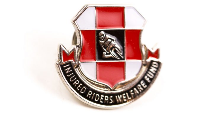 Red and white metal badge