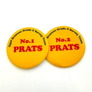 Two yellow button badges