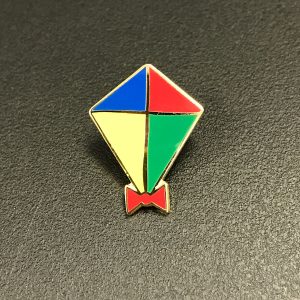 Kite pin badge with red, blue, green and yellow