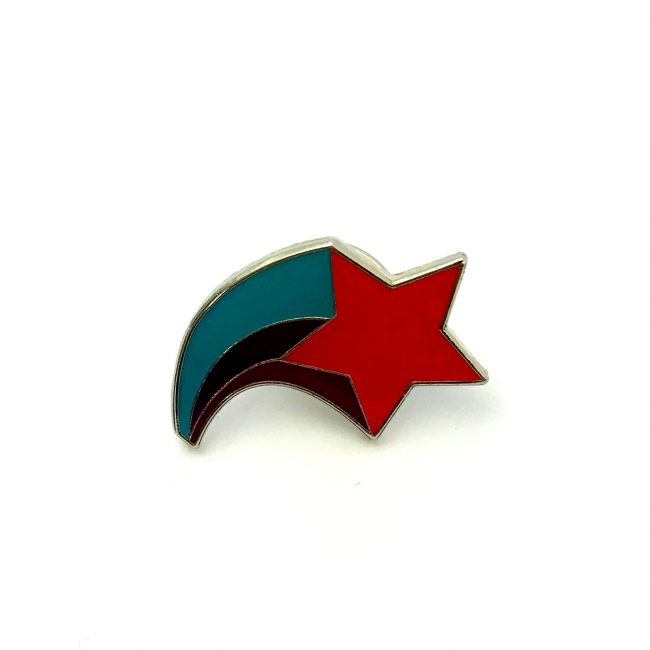 Red shooting star with green and black metal badge