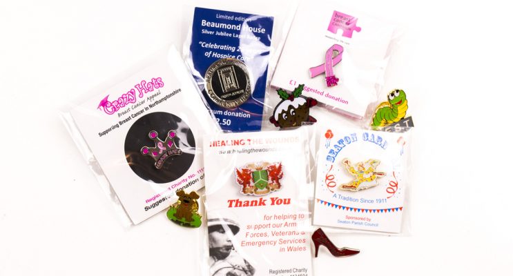 promotional charity pin on backing cards