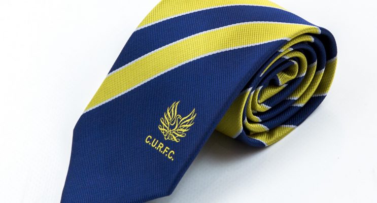 Blue rolled tie with thick yellow stripes