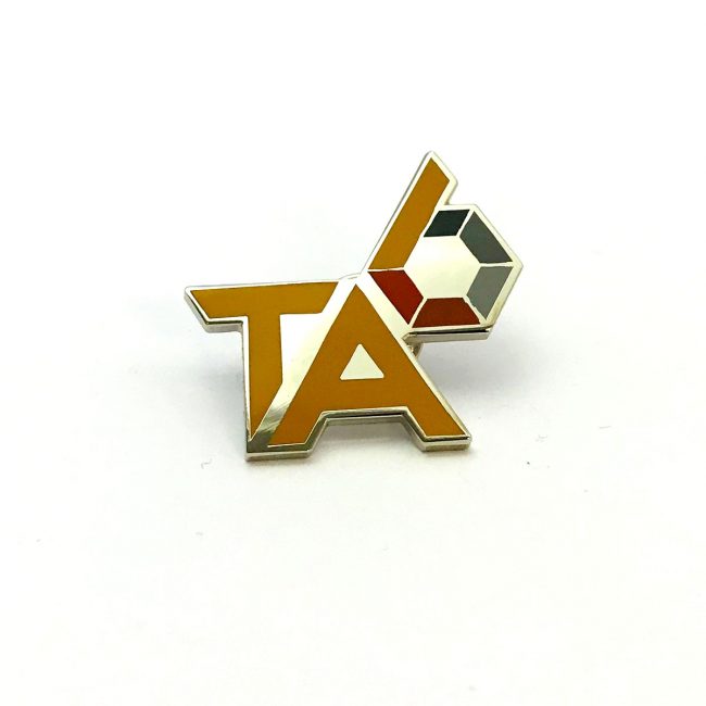 TA logo gold metal pin badge