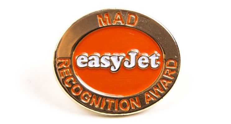 Gold and orange EasyJet logo award badge