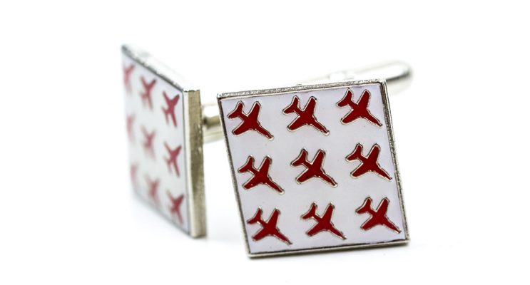 Square white cufflinks with red airplanes on