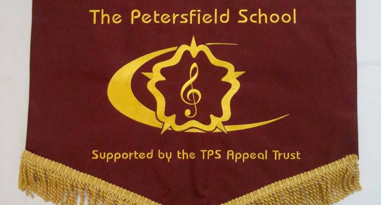 Brown and yellow school pennants with school logo