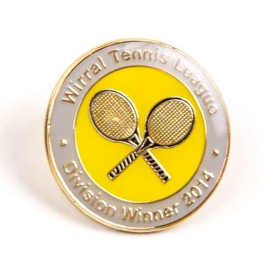 Tennis rackets on metal spots badge