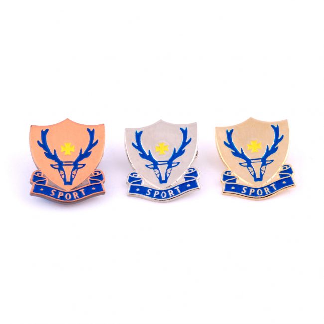 Three sport badges with reindeer logo on