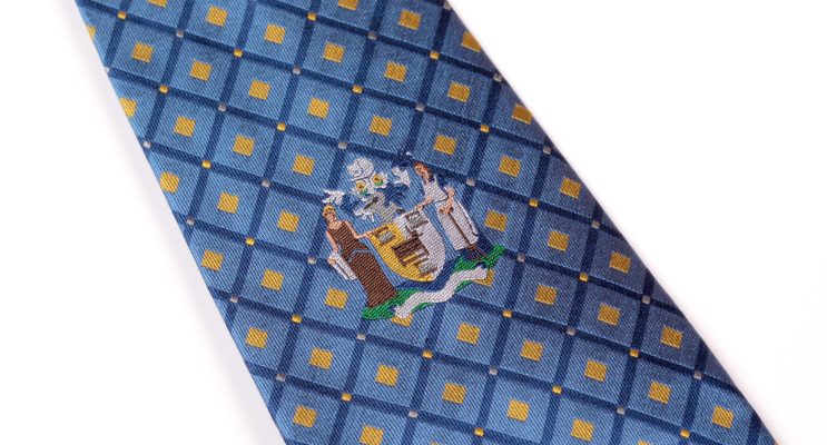 Blue logo with yellow diamonds and embroidered logo