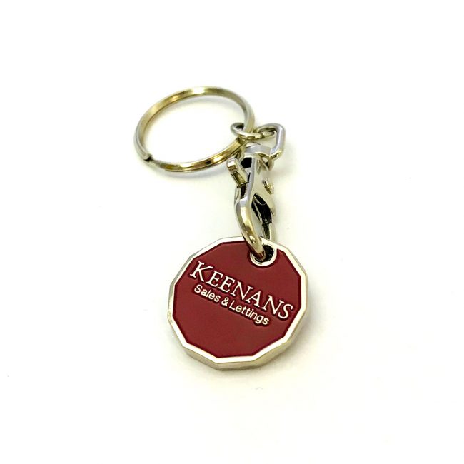 Red trolley coin with Keenans logo and metal chain