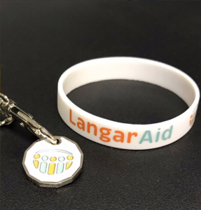 Langar Aid Chairty Trolley coin and wristband