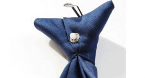 Close up of plastic tie fitting on blue tie