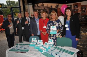 Tameside Hospital staff at networking event with pin badges and flyers